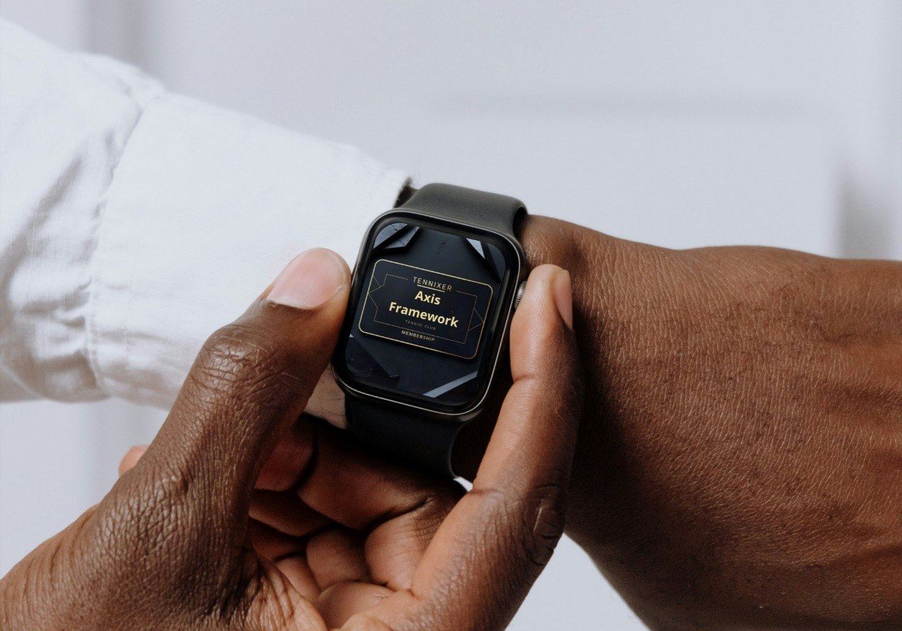 Person holding a smartwatch with a blurred background