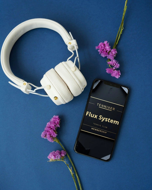 White headphones and a phone with 'Tennixer Flux System' on a blue background with purple flowers.