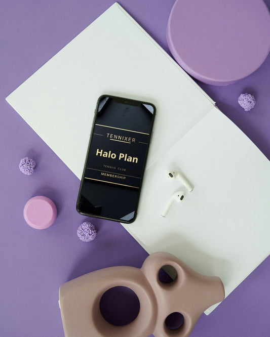 Phone displaying 'Tennixer Halo Plan' on a purple surface with minimal decor