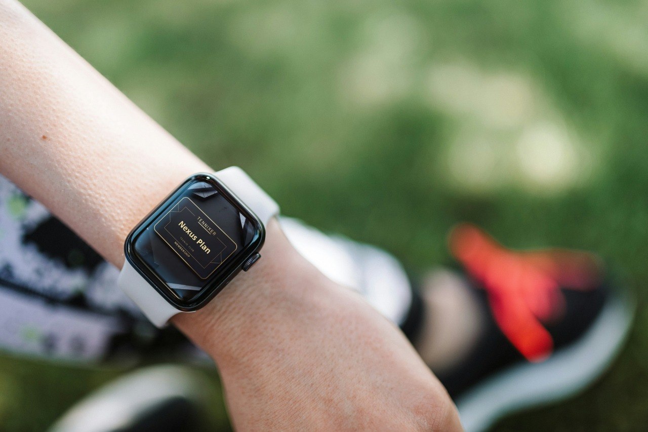 Smartwatch on a wrist with a blurred outdoor background