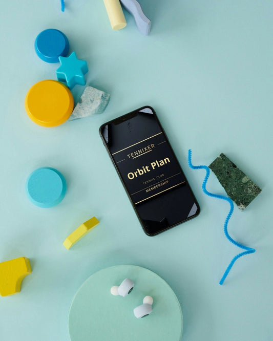 Phone displaying 'Fenixler Orbit Plan' on a light blue background with colorful geometric shapes.