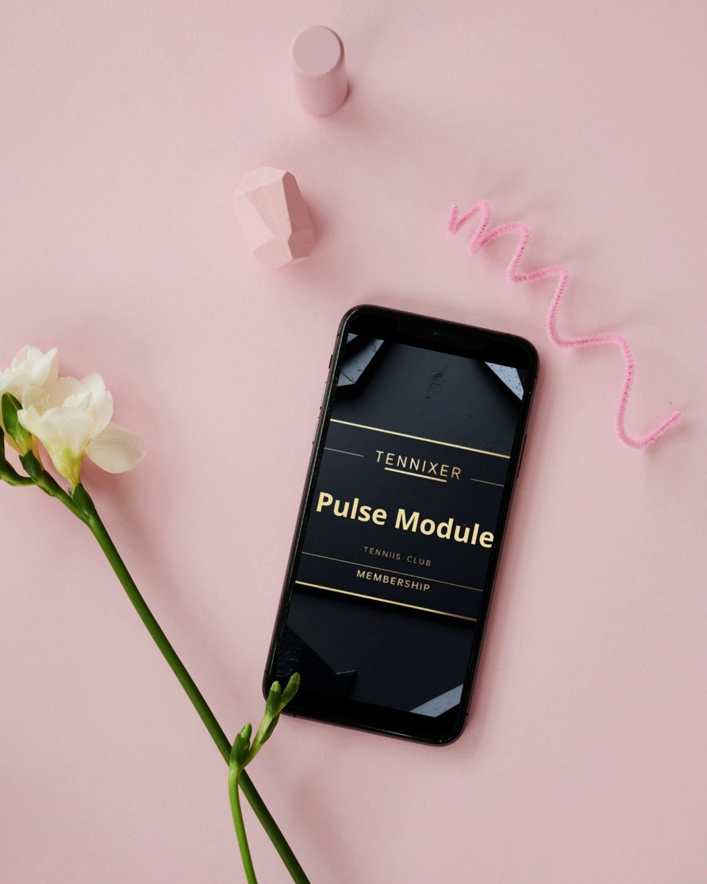 Phone displaying 'Tennixer Pulse Module' on a pink background with flowers and decorative elements.